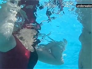 buried underwater with a penis inside her