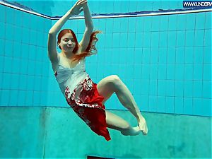 sizzling polish redhead swimming in the pool