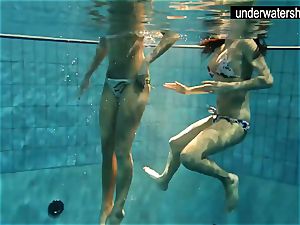 two stellar amateurs showing their bodies off under water
